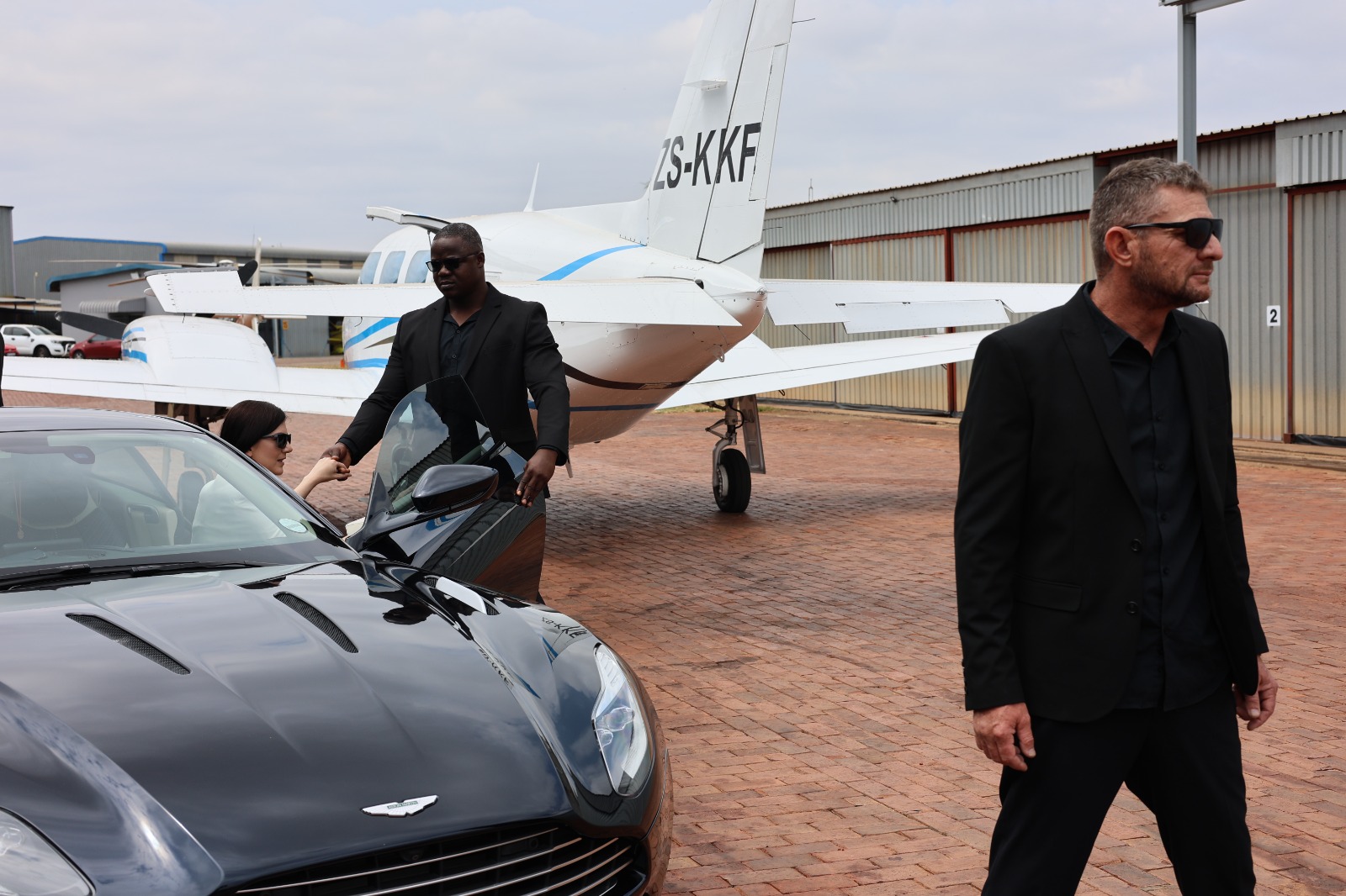 BI Protection CPOs escorting principal from aircraft to vehicle